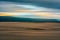 Sunset over sand dunes abstract background. Mountains and colorful cloudy sky on background Royalty Free Stock Photo