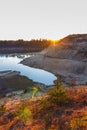 Sunset over the sandy cliffs and lake landscape Royalty Free Stock Photo