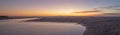 Sunset over Santa Clara River tidal outflow to Pacific Ocean at McGrath State Park on the California coast at Ventura - USA Royalty Free Stock Photo