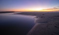 Sunset over Santa Clara River tidal outflow to Pacific Ocean at McGrath State Park on the California coast at Ventura - USA Royalty Free Stock Photo