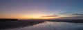 Sunset over Santa Clara River tidal outflow to Pacific Ocean at McGrath State Park on the California coast at Ventura - USA Royalty Free Stock Photo