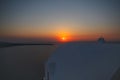 Sunset over Santorini island in Greece, apartments in Oia village on a sunset Royalty Free Stock Photo