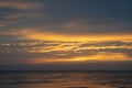 Beautiful sunset over the sea. Seascape. Orange clouds.