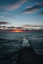 Beautiful sunset over the sea. Unusual clouds. Sea pier. Seascape. Royalty Free Stock Photo