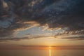 Beautiful sunset over the sea. Sun and clouds. Seascape. Rest on the sea.