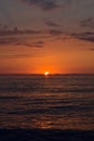 Beautiful orange sunset over the sea. Sun and clouds. Seascape. Royalty Free Stock Photo