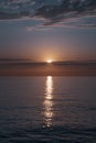 Reflection of the sun in the water. Sunset over the sea. Beautiful seascape. Rest on the sea.