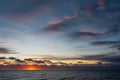 Beautiful sunset over the sea. Colorful cirrus clouds.