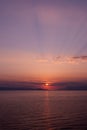 Sunset over the sea with blue purple hue, vertical Royalty Free Stock Photo