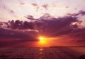 Sunset over sea clouds sun ray Royalty Free Stock Photo