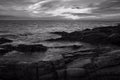 Sunset over the sea with dramatic sky in black and white Royalty Free Stock Photo