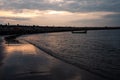 Sunset over the sea with a fishing boat Royalty Free Stock Photo