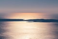 Sunset over the sea and islands. Orange and yellow colours of sunset reflecting in the Adriatic Sea. Royalty Free Stock Photo