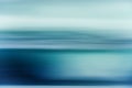 Sunset over the sea in light blue and turquoise colors, abstract seascape background, line art, soft blur Royalty Free Stock Photo