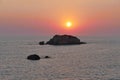 Sunset over the sea at Prasoudi, Corfu seen from the balcony of a tavern Royalty Free Stock Photo