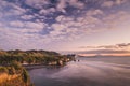 Sunset over sea shore rocks and mount Taranaki, New Zealand Royalty Free Stock Photo