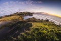 Sunset over sea shore rocks and mount Taranaki, New Zealand Royalty Free Stock Photo