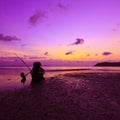 Sunset over sea with small wooden boat Royalty Free Stock Photo