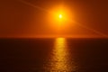 Sunset over the sea with sunlight reflection Royalty Free Stock Photo