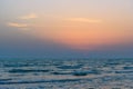 Sunset over the sea on wild beach of Persian gulf coast. Iran Royalty Free Stock Photo