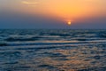 Sunset over the sea on wild beach of Persian gulf coast. Iran Royalty Free Stock Photo