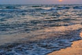 Sunset over the sea on wild beach of Persian gulf coast. Iran Royalty Free Stock Photo