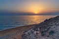 Sunset over the sea on wild beach of Persian gulf coast. Iran Royalty Free Stock Photo