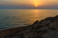 Sunset over the sea on wild beach of Persian gulf coast. Iran Royalty Free Stock Photo