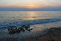 Sunset over the sea on wild beach of Persian gulf coast. Iran Royalty Free Stock Photo