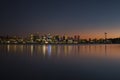 Sunset over Seattle`s skyline creating reflections in Lake Washington Royalty Free Stock Photo