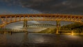 Sunset over the Second Narrows Bridge Ironworkers Bridge of the Trans Canada Highway and a Railway Bridge, Vancouver, Canada Royalty Free Stock Photo