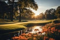 Sunset over a serene golf course with vibrant flowers in the foreground
