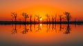Sunset over a serene lake with dead trees reflecting Royalty Free Stock Photo