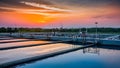 Sunset Over Sewage Treatment Aeration Tanks. Concept Sunset, Sewage Treatment, Aeration Tanks Royalty Free Stock Photo