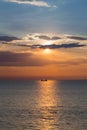 Sunset over the ship over ocean