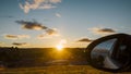 Sunset over small country town with car mirror