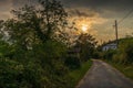 Sunset over a small rural street Royalty Free Stock Photo