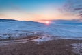 Sunset over the snow-capped mountains of the protected Olkhon island. Lake Baikal, Siberia, Russia Royalty Free Stock Photo