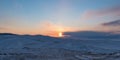 Sunset over the snow-capped mountains of the protected Olkhon island. Lake Baikal, Siberia, Russia Royalty Free Stock Photo