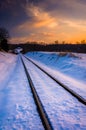 Sunset over snow-covered railroad tracks in Carroll County, Mary Royalty Free Stock Photo