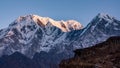 Sunset over snowcapped mountain peak Annapurna South in Himalayas Royalty Free Stock Photo