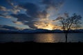 Sunset over snowy mountain and fjord landscape Royalty Free Stock Photo