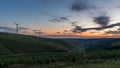 Sunset over the south Wales valleys from the Bwlch mountain. A road winds around the hillside to the village of Abergwynfi. Royalty Free Stock Photo