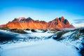 Sunset over the Stokksnes Mountain on Vestrahorn Cape with Snow in Iceland