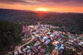 Sunset over Thai tribe village with wild himalayan cherry tree blooming in countryside at Ban Rong Kla Royalty Free Stock Photo