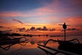 Sunset over traditional fishing boats on Bali Royalty Free Stock Photo