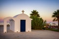 Sunset over traditional Greek chapel on seaside of resort Faliraki in Rhodes island, Greece Royalty Free Stock Photo