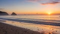 Sunset over a tranquil beach with gentle waves lapping against the shore Royalty Free Stock Photo