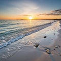 Sunset over a tranquil beach with gentle waves lapping the shoreline Royalty Free Stock Photo