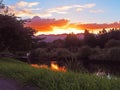 Sunset over a tranquil stream Royalty Free Stock Photo